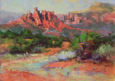 plein air soft pastel painting of red rock outcrops by Sharon Bamber